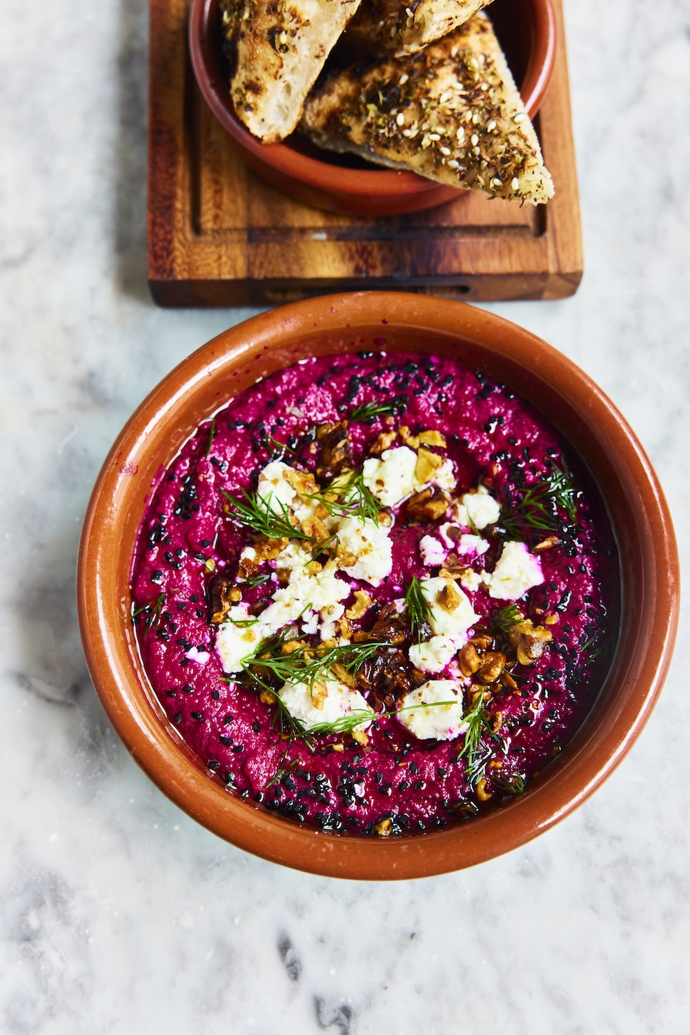 Vibrant beetroot borani with feta and walnuts served as a starter at Pizza on the Park, the Italian restaurant in Bristol known for creative Italian-inspired dishes. David Loftus captures the colourful presentation that complements the Italian dining experience in Clifton.